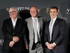 FILE - In this April 13, 2017, file photo, Vegas Golden Knights coach Gerard Gallant is flanked by Bill Foley, left, owner of the Vegas Golden Knights, and George McPhee, Vegas Golden Knights general manager, in Las Vegas. Vegas Golden Knights general manager George McPhee certainly wouldn&#039;t mind some Lady Luck to rub off on his NHL expansion franchise when it comes to how the balls drop in the league&#039;s draft lottery on Saturday. (AP Photo/John Locher, File)