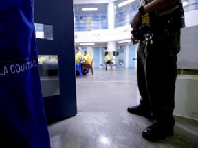 A Sheriff officer stands guard over inmates at the Twin Towers Correctional Facility Thursday, April 27, 2017, in Los Angeles. One of the world&#039;s largest jail complexes is located in Los Angeles and within it resides perhaps the world&#039;s largest group of inmates whose mental illness is attributed to drug abuse, mainly from highly addictive methamphetamine. (AP Photo/Chris Carlson)