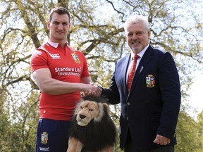 British & Irish Lions head coach Warren Gatland, right, and tour captain Sam Warburton, pose for the cameras  during the British and Irish Lions Squad Announcement event  in London Wednesday April 19, 2017.  The Lions will tour tour New Zealand this summer.