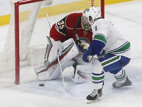 Vancouver Canucks' Brock Boeser scores against Minnesota Wild goalie Darcy Kuemper as he made his NHL debut in March.