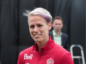 Sophie Schmidt talks to media as the Canadian women's soccer team pose for a team photo before they head to the Olympic Games in Rio., in Burnaby, BC., July 11, 2016.