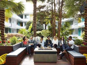 A fire pit and palm trees create a cosy feeling in The Burrard’s small courtyard.
