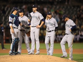 James Paxton of the Seattle Mariners waits for the manager to take him out of the game after giving up a run in the fifth inning against the Oakland Athletics at Oakland Alameda Coliseum on April 20, 2017 in Oakland, California.