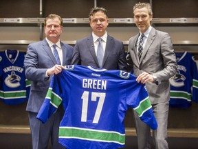 Left to right: Canucks GM Jim Benning, new head coach Travis Green and president of hockey operations, Trevor Linden at Rogers Arena in Vancouver Canucks in Vancouver, B.C., April 26, 2017.