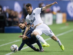 Andrew Jacobson of Vancouver, tackling Jermaine Jones of the L.A. Galaxy off the ball on this play, says the Whitecaps are starting to find their team chemistry.