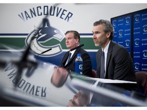 Vancouver Canucks general manager Jim Benning (left) and Trevor Linden, president of hockey operations.