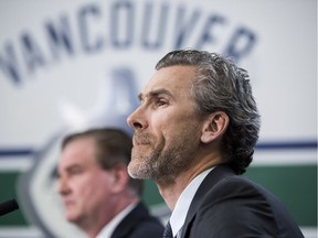 Canucks general manager Jim Benning, left, and Trevor Linden, president of hockey operations, hold a media presser Monday in Vancouver to announce that head coach Willie Desjardins will be relieved of his duties.