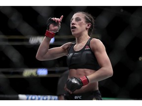 Joanna Jedrzejczyk reacts at the end of her women's strawweight title mixed martial arts bout against Karolina Kowalkiewicz during a at UFC 205, early Sunday, Nov. 13, 2016, at Madison Square Garden in New York. Jedrzejczyk won by decision.