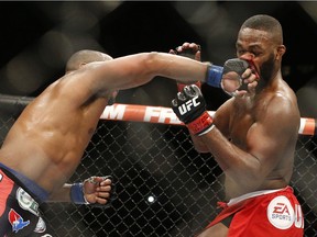 Daniel Cormier, left, lost this title bout with Jon Jones, right, at UFC 182 in Las Vegas, but he's held the title since winning the vacant belt in 2015.