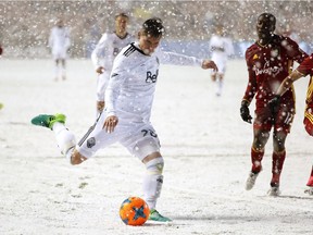 Vancouver Whitecaps defender Jake Nerwinski takes a shot on goal against Real Salt Lake midfielder Demar Phillips in the second half at Rio Tinto Stadium on Saturday.