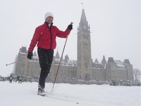 Senator Nancy Greene skis around the front lawn of the Parliament buildings during an event promoting the National Health and Fitness day in Ottawa on Feb. 24, 2016. Sen. Nancy Greene Raine, Canada's most decorated ski racer, is undergoing treatment for thyroid cancer.