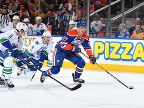 Connor McDavid of the Oilers breaks away from the Canucks.