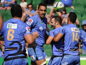 Western Force players celebrate the team's first try during the Super Rugby match against South Africa's Kings in Perth on April 9, 2017.