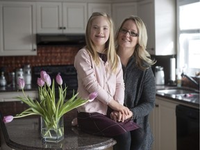 Sandra Wallace and her daughter Camryn, 10, are shown in their home in Carp, Ont. on Wednesday, Jan. 27, 2016. Electronic medical records have helped manage hospital appointments for Camryn, who was born with Down's Syndrome.