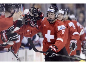 The Vancouver Canucks, who have never been super lucky at the NHL draft, hope to get their hands on a skilled centre like Nico Hischier, shown celebrating a goal at the World Junior Hockey Championship, to help speed up their rebuilding process.