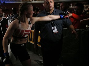 Valentina Shevchenko, left, of Kyrgyzstan, celebrates with fans after defeating Holly Holm in a women's bantamweight mixed martial arts bout at United Center last July. Shevchenko should be in line for a rematch with Amanda Nunes for the title later this year.