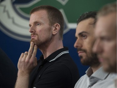 Vancouver, BC: April 11, 2017 -- Vancouver Canucks players face the media at Rogers Arena Tuesday, April 11, 2017. Pictured is Daniel Sedin (left) with Ryan Miller and Alex Edler.