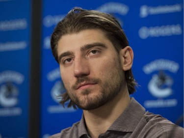 Vancouver, BC: April 11, 2017 -- Vancouver Canucks players face the media at Rogers Arena Tuesday, April 11, 2017. Pictured is Chris Tanev.