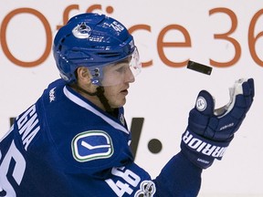 Vancouver Canucks centre Jayson Megna (46) keeps his eye on the puck during third period NHL action against the Pittsburgh Penguins, in Vancouver on Saturday, March 11, 2017.