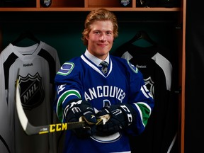 Brock Boeser poses for a portrait after being selected 23rd overall by the Vancouver Canucks in the first round of the 2015 NHL Entry Draft in June in Sunrise, Fla.