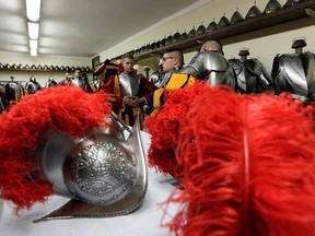 New Vatican Swiss Guards wear their uniforms and armors prior to a swearing-in ceremony, at the Vatican, Saturday, May 6, 2017. The ceremony is held each May 6 to commemorate the day in 1527 when 147 Swiss Guards died protecting Pope Clement VII during the Sack of Rome. (AP Photo/Andrew Medichini)