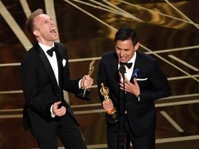 File- This Feb. 26, 2017, shows Justin Paul, left and Benj Pasek, right, accepting the award for best original song for &ampquot;City of Stars&ampquot; from &ampquot;La La Land&ampquot; at the Oscars at the Dolby Theatre in Los Angeles. The Fox network is getting in the Christmas spirit with its announcement Friday of &ampquot;A Christmas Story,&ampquot; a live TV musical scheduled for December. Pasek and Paul, recent Tony Award nominees for the musical ‚ÄúDear Evan Hansen,‚Äù and lyricists of ‚ÄúLa La Land‚Äôs‚Äù Oscar-winning song, ‚ÄúCity