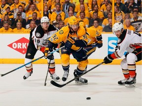 Ryan Johansen of the Nashville Predators skates against Ondrej Kase and Cam Fowler of the Anaheim Ducks during the first period in Game 3 of the Western Conference Final during the 2017 Stanley Cup Playoffs at Bridgestone Arena in Nashville, Tenn.