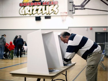 B.C. Green party leader Andrew Weaver fills out his ballot at Gordon Head Middle School on election day in Victoria, B.C., on Tuesday, May 9, 2017.