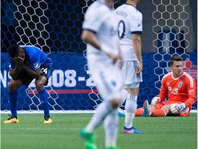 Montreal Impact's Anthony Jackson-Hamel, left, reacts after missing an open net and failing to score against Vancouver Whitecaps' goalkeeper Spencer Richey during Canadian Championship semifinal soccer action in Vancouver on Tuesday May 23.