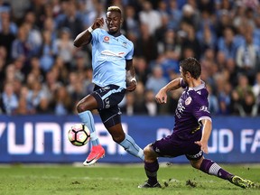 Bernie Ibini of Sydney FC is tacked by Dino Djulbic of the Glory during the A-League Semi Final match between Sydney FC and the Perth Glory at Allianz Stadium on April 29, 2017 in Sydney, Australia.