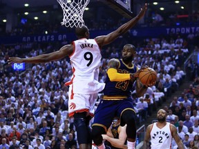 Lebron James #23 of the Cleveland Cavaliers looks to pass the ball as Serge Ibaka #9 of the Toronto Raptors defends in the first half of Game Four of the Eastern Conference Semifinals during the 2017 NBA Playoffs at Air Canada Centre on May 7, 2017 in Toronto.