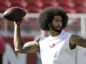 In this photo take Oct. 23, 2016, San Francisco 49ers quarterback Colin Kaepernick warms up before an NFL football game against the Tampa Bay Buccaneers in Santa Clara, Calif. I