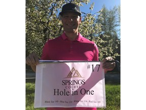 Doug Schneider holds the flag for his hole-in-one at Radium Hot Springs earlier this week.
