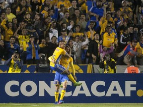 Mexico´s Tigres players celebrate after scoring against the Whitecaps during the first leg of semi-final of the CONCACAF Champions League football, match at the Estadio Universitario in Monterrey in March.
