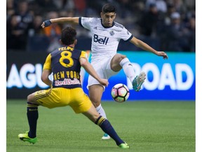 Whitecaps Matias Laba in action earlier this year against the New York Red Bulls. Laba was lost for the season during Saturday's loss in New England when he suffered an ACL tear in his right knee.