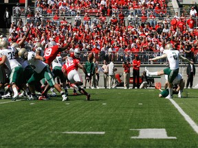 B.C. Lions signee Ty Long kicking in college for University of Alabama-Birmingham against Ohio State in 2012.