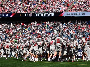 The Ohio State Buckeyes celebrate after beating the Towson Tigers in the NCAA men's lacrosse national semifinal Saturday at Gillette Stadium.