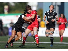 Team Canada's Ghislaine Landry, is tackled by a New Zealand player during Cup final action at the HSBC Canada Women's Sevens at Westhills Stadium in Langford on Sunday. Team Canada lost to New Zealand 17-7.