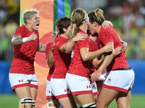 Canada players including team captain Jen Kish celebrate a try during women's rugby sevens bronze medal game action against Great Britain at the 2016 Olympic Games in Rio de Janeiro, Brazil on Monday, Aug. 8, 2016.