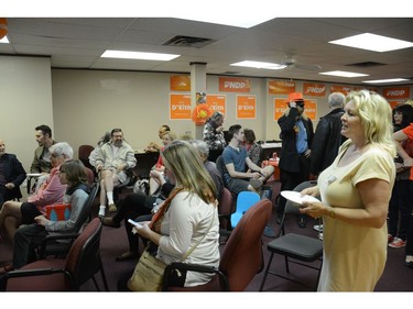 NDP supporters watch results come in at candidates Lisa Beare and Bob D'Eith's campaign office.