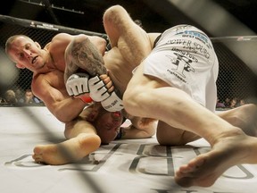 Misha Cirkunov, left, of Xtreme Couture in Toronto makes short work of Shaun Asher of Alliance MMA in Cincinnati during HK43 at the Markin McPhail Centre in Calgary on May 22, 2015.