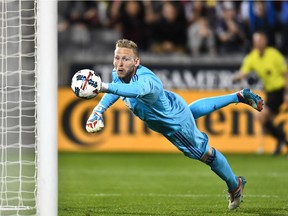 David Ousted in his Whitecaps days, clearing the ball off the goal-line against the Colorado Rapids during a May 2017 Major League Soccer game.