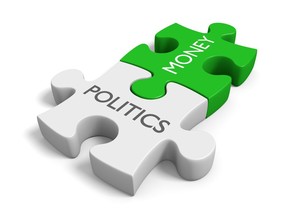 The two connected puzzle pieces, with the words politics and money, represent the influence of wealth in elections.