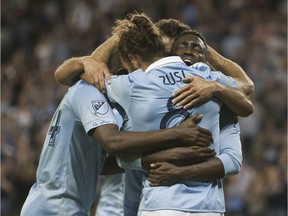 Sporting Kansas City celebrate a goal during their 3-0 victory over the visiting Seattle Sounders on Wednesday night in Kansas City.