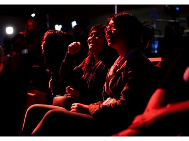 NDP supporters are illuminated by orange light while watching results at NDP election night headquarters in Vancouver, B.C., on Tuesday May 9, 2017.