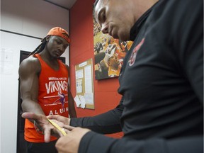 Tyler Davis gets his hand measured before B.C. Lions rookie camp earlier this week. One of the things that struck coach Wally Buono about Davis was his catching ability. 'He showed he has excellent, excellent hands,' said Buono.