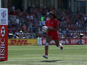 Team Canada's Charity Williams runs in for a try during rugby action against Team France at the HSBC Canada Women's Sevens at Westhills Stadium in Langford on Saturday.