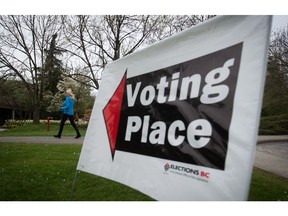 A woman arrives at a polling station to vote in the B.C. election in the Vancouver-Fraserview riding May 9.