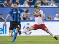 Montreal Impact midfielder Marco Donadel, left, and Toronto FC forward Sebastian Giovinco battle for the ball during second half of the first leg of the Canadian Championship soccer final action, in Montreal on Wednesday, June 21, 2017. THE CANADIAN PRESS/Paul Chiasson ORG XMIT: pch110