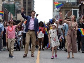 Prime Minister Justin Trudeau, his wife Sophie Gregoire Trudeau and their children Ella-Grace and Xavier walk in the Pride parade in Toronto, Sunday, June 25, 2017. THE CANADIAN PRESS/Mark Blinch